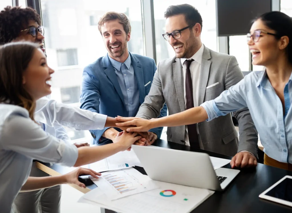 Business team celebrating a good job in the office
